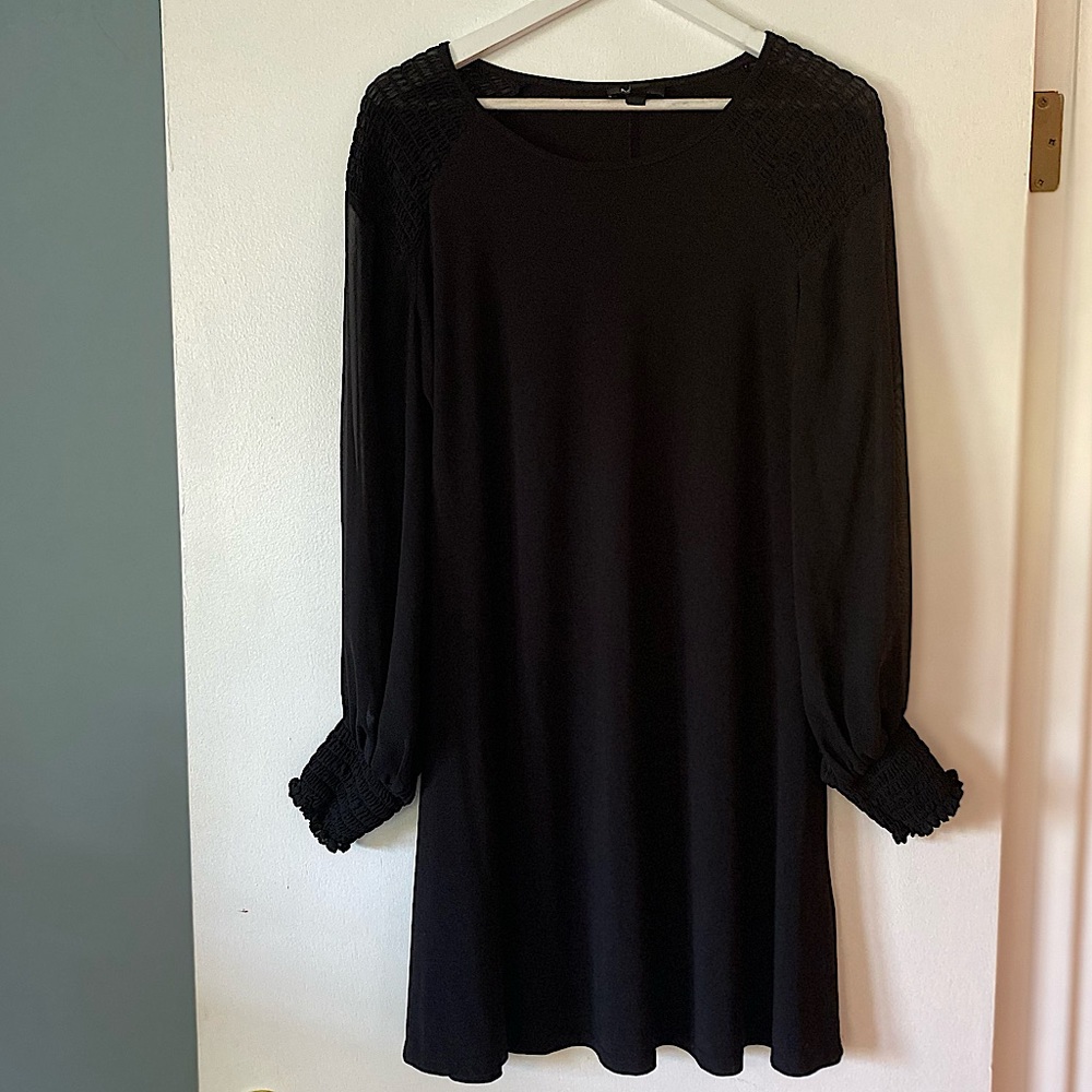 Knee length black dress with sheer sleeves